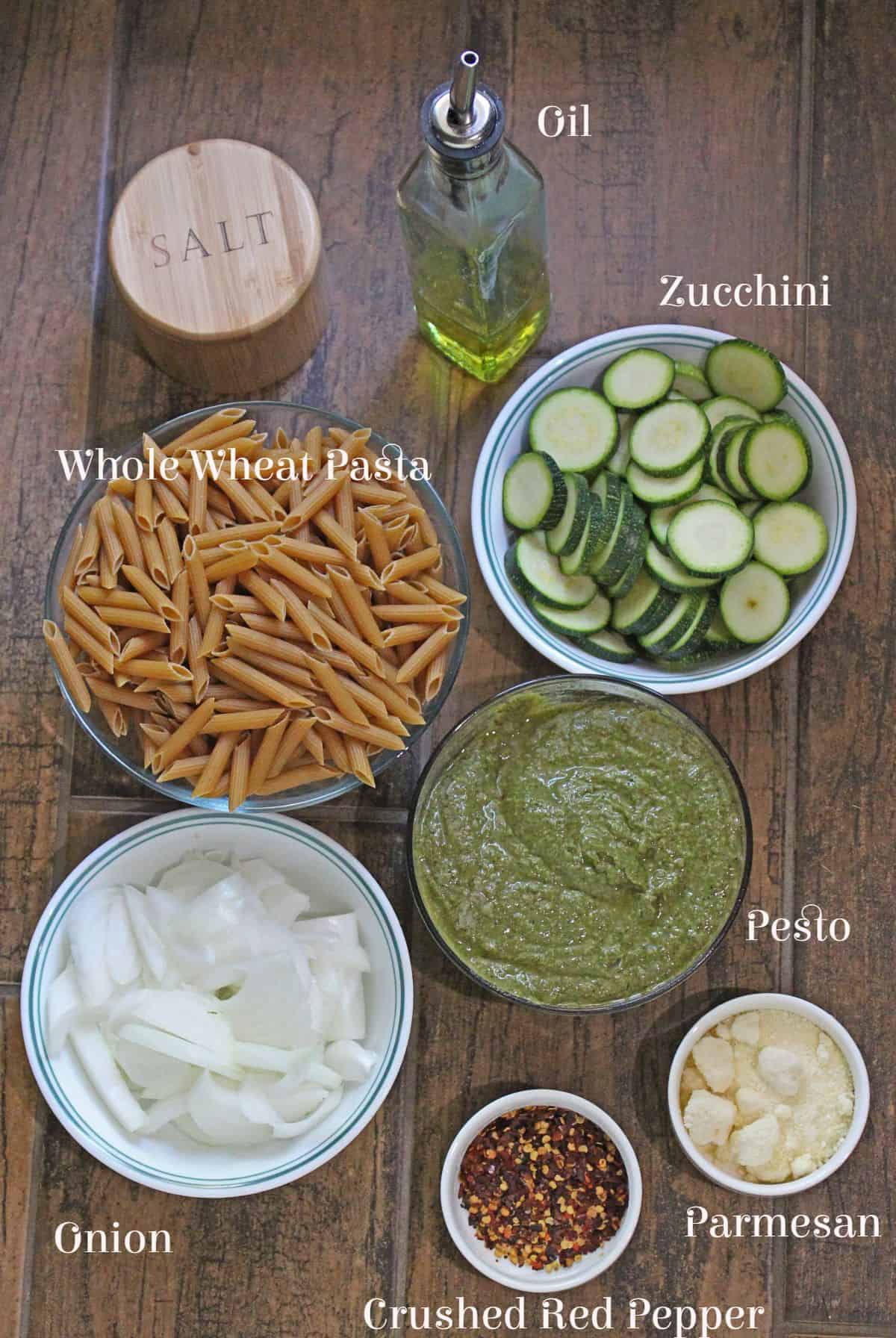 Ingredients laid out and labelled for zucchini pesto pasta